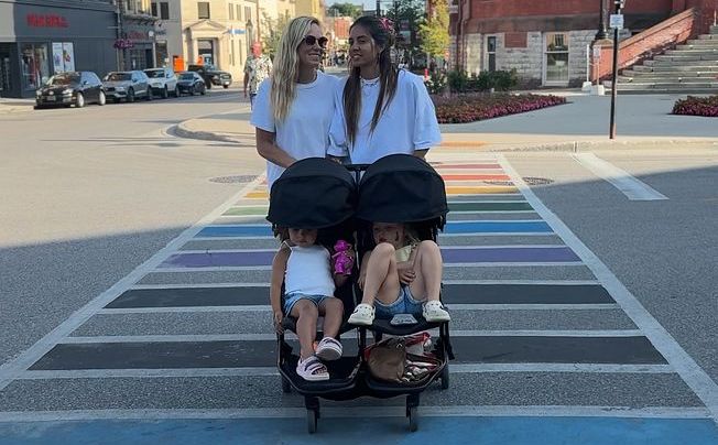 Our family crossing the rainbow crosswalk in downtown Stratford, Ontario
