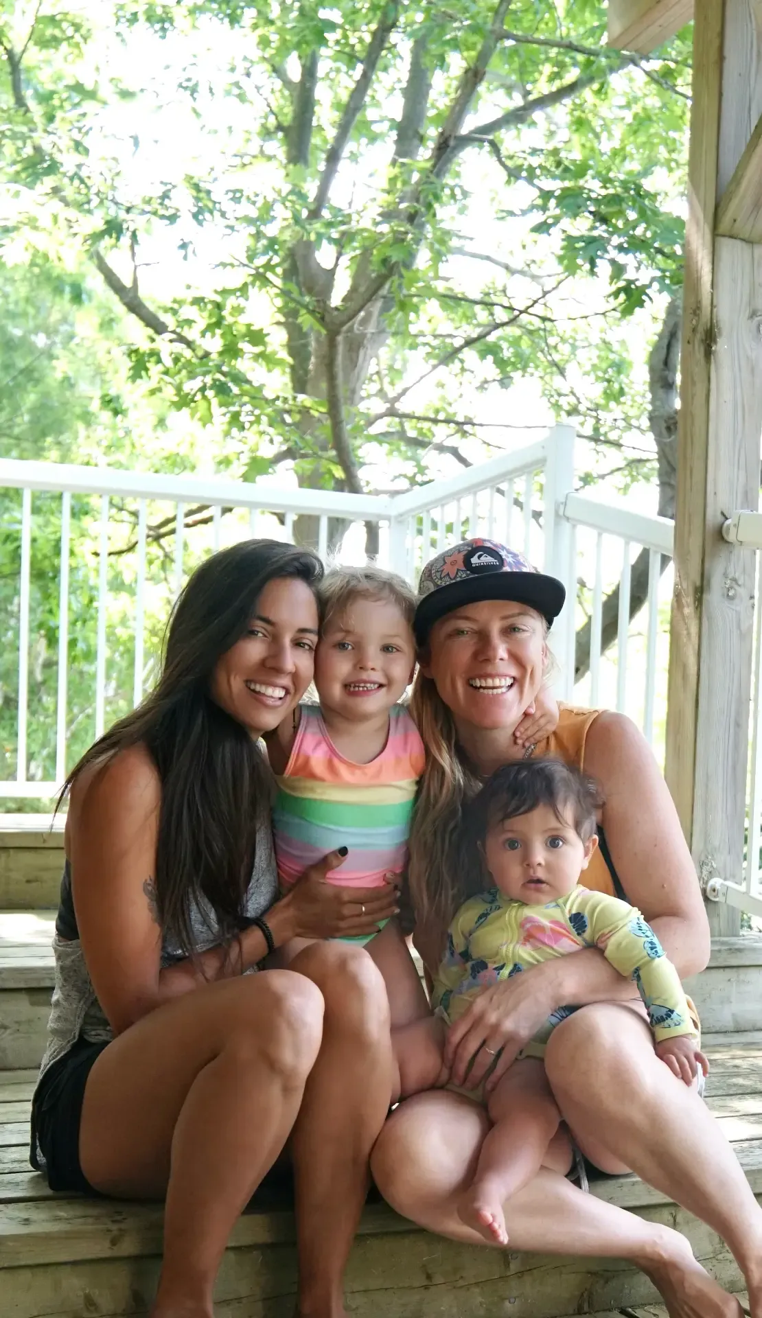 Our family sitting together on stone porch steps