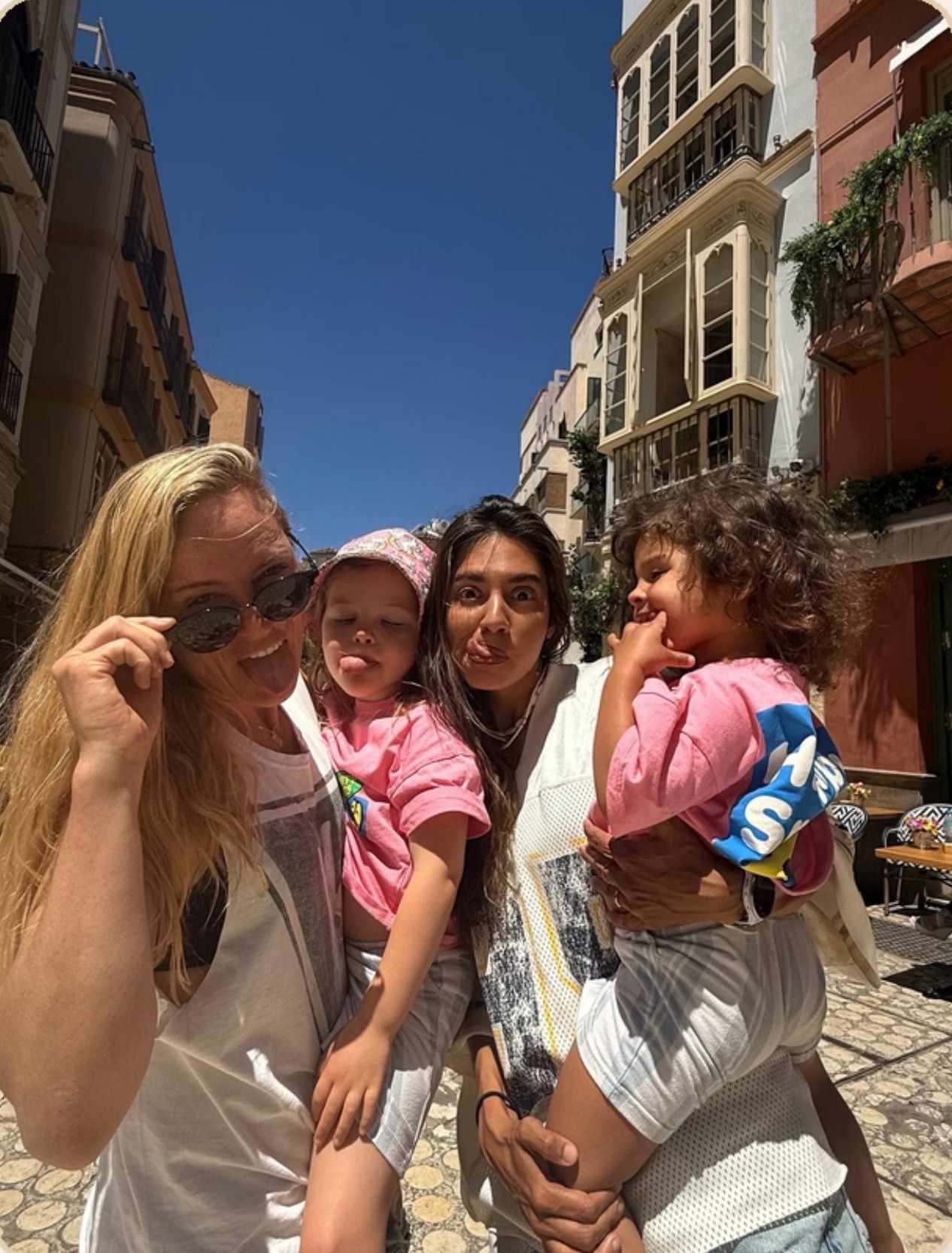 Family road trip along a sunny coastal road in Spain and Portugal
