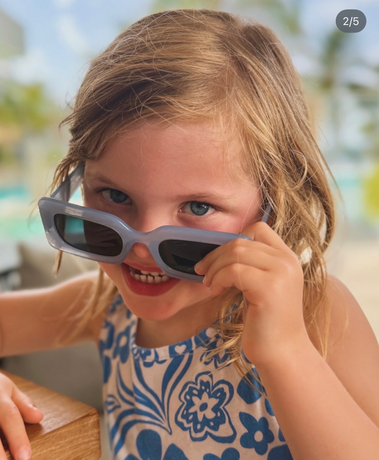 Their older daughter in sunglasses