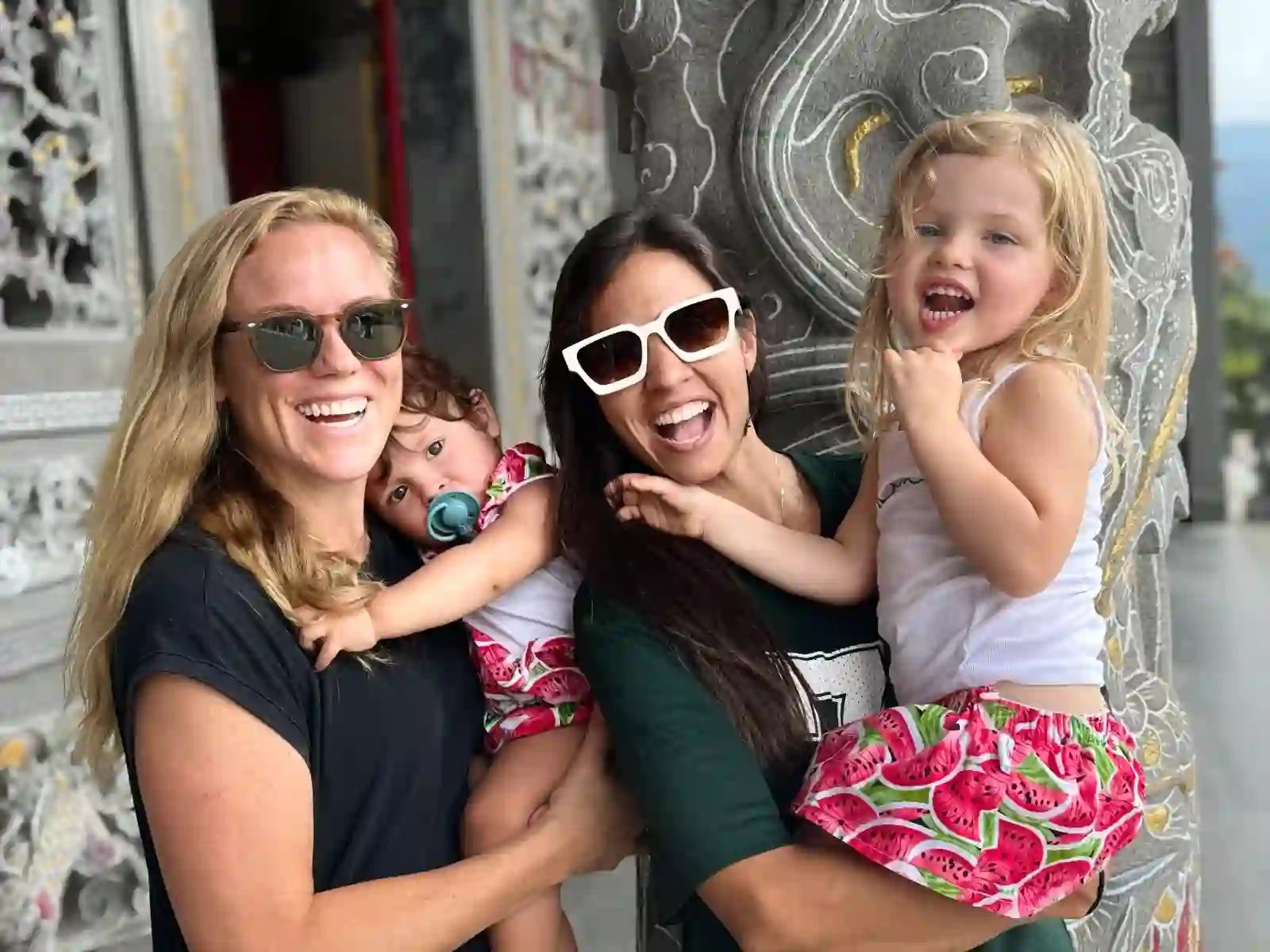 Our family together while exploring a temple courtyard abroad