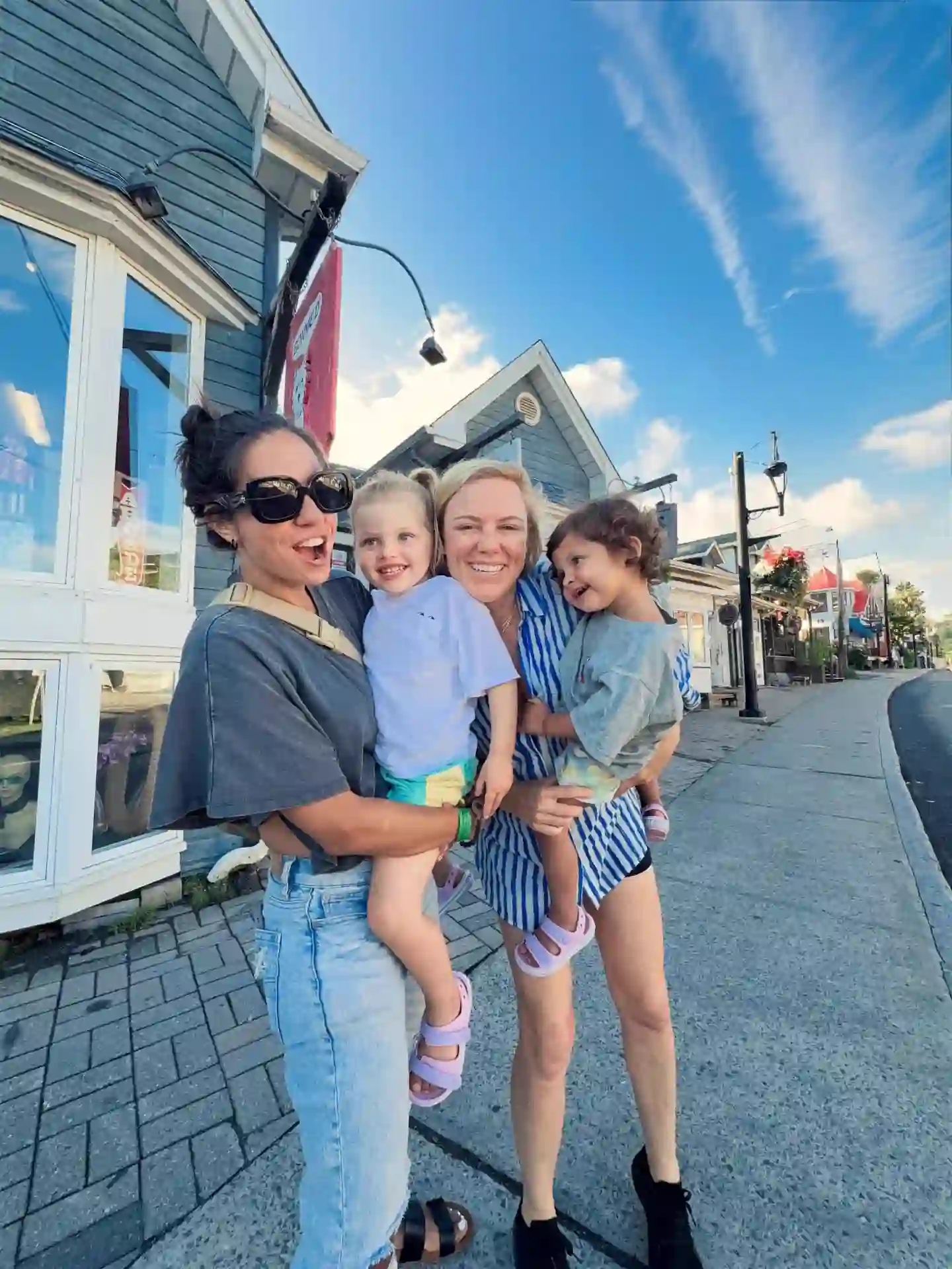 Walking a sunny town street together as a family
